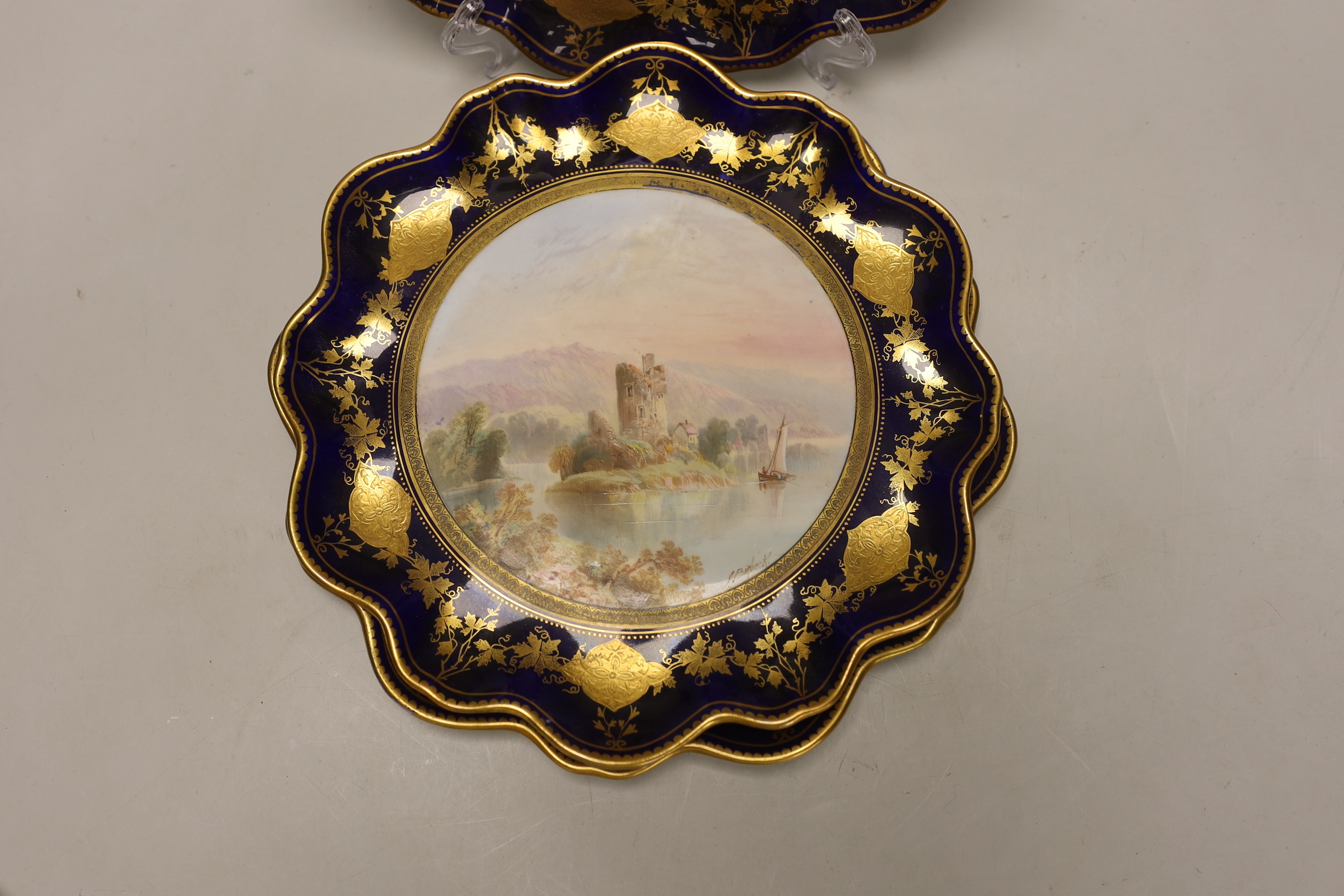 A set of four Victorian bone china cabinet plates, each painted with a named view by J Birbeck